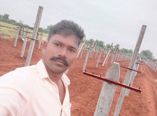 Mr Chandu with his draogn farm in the background